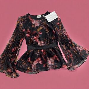 Gorgeous peplum top with flare sleeves. Brand new with tags.